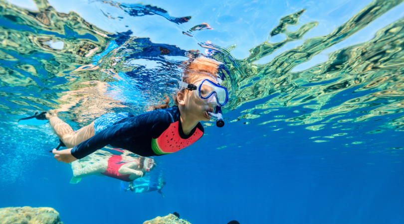 Kid snorkeling underwater