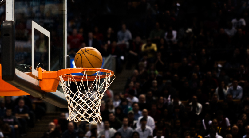 Basketball going into hoop at game